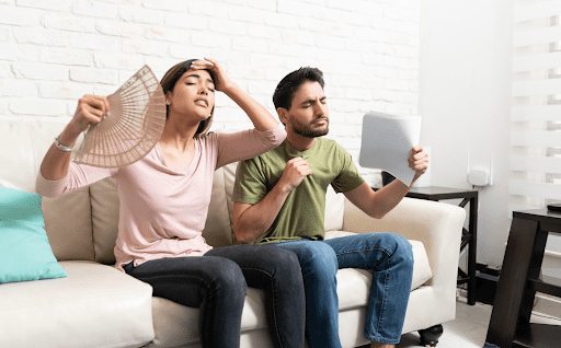 A man and woman sitting on the couch